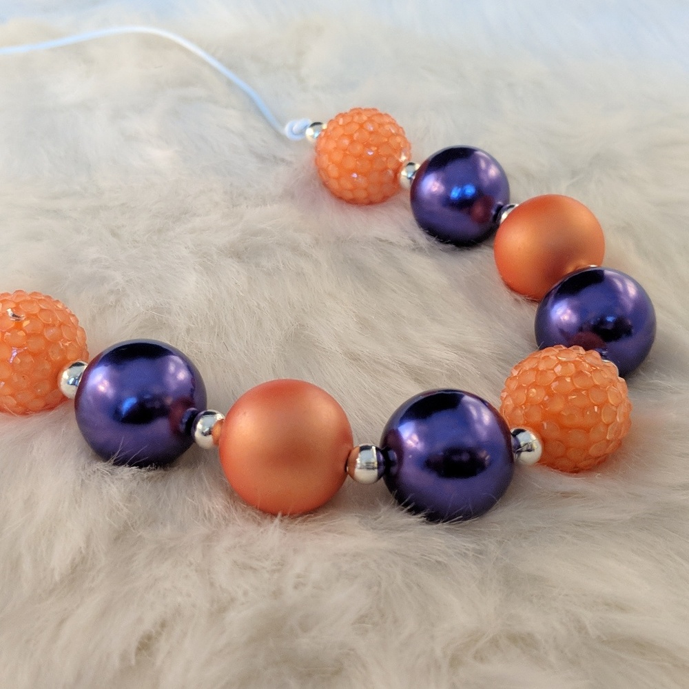 Purple and Orange; Pearl necklace